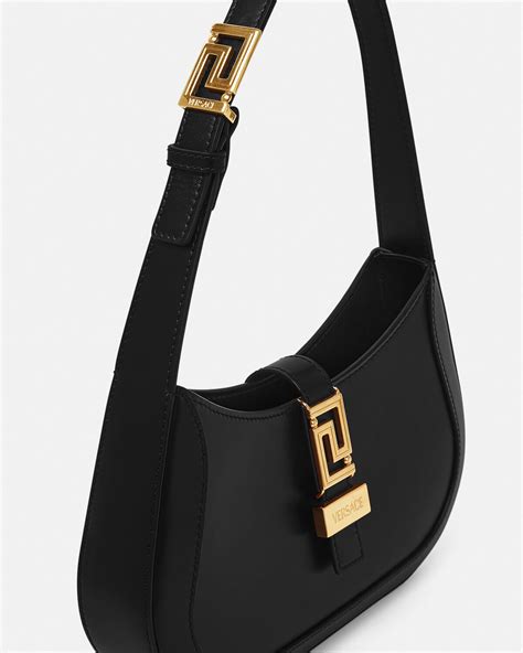 models carrying the versace greca goddess small small shoulder bag|Versace Greca Goddess Small Shoulder Bag.